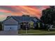 Charming home exterior with a well-maintained lawn, mature landscaping, and a welcoming entrance at 6159 Fieldstone Cir, Charleston, SC 29414