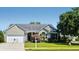 Charming single-story home featuring a two-car garage and well-manicured lawn at 6159 Fieldstone Cir, Charleston, SC 29414