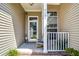 Welcoming front porch featuring the house number, seating and nice landscaping at 6159 Fieldstone Cir, Charleston, SC 29414