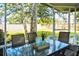 Relaxing screened porch with seating overlooking the backyard at 6159 Fieldstone Cir, Charleston, SC 29414