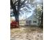 Charming single-story home featuring light blue siding, covered porch, and mature landscaping at 708 Francis St, Walterboro, SC 29488