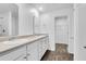 Bathroom featuring dual sinks, white cabinetry, and a walk-in closet at 715 Hilchot Dr, Summerville, SC 29486