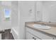 Bright bathroom featuring a white vanity, a large mirror, and a shower/tub combination at 715 Hilchot Dr, Summerville, SC 29486
