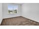 Neutral bedroom with a window overlooking a view of the neighborhood at 715 Hilchot Dr, Summerville, SC 29486