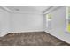 Sunny bedroom with plush carpet, tray ceilings, and a large window with natural light at 715 Hilchot Dr, Summerville, SC 29486