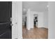Welcoming foyer featuring wood-look flooring and an open view into the modern kitchen and dining area at 715 Hilchot Dr, Summerville, SC 29486