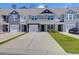 Charming townhomes with private driveways, manicured lawns, and inviting curb appeal at 715 Hilchot Dr, Summerville, SC 29486