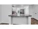 Modern kitchen featuring stainless steel appliances, white cabinets, and a breakfast bar at 715 Hilchot Dr, Summerville, SC 29486