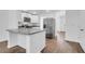 Modern kitchen with stainless steel appliances, an eat-in island, and natural light at 715 Hilchot Dr, Summerville, SC 29486