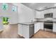 Contemporary kitchen with stainless steel appliances, eat-in island, and access to the outdoor area at 715 Hilchot Dr, Summerville, SC 29486