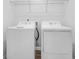 Laundry room featuring a white washer and dryer with white shelving and tile floor at 715 Hilchot Dr, Summerville, SC 29486