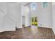 Spacious living room showcasing high ceilings, hardwood floors, and a staircase at 715 Hilchot Dr, Summerville, SC 29486