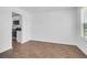 Bright living room with hard wood flooring and ample natural light, adjacent to kitchen at 715 Hilchot Dr, Summerville, SC 29486