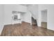 Open-concept living room with hardwood floors seamlessly connects to the modern kitchen at 715 Hilchot Dr, Summerville, SC 29486