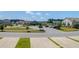 Residential neighborhood featuring sidewalks, manicured lawns, and a community pond on a bright, sunny day at 715 Hilchot Dr, Summerville, SC 29486