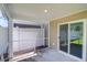 Covered back patio features vinyl siding, privacy fence, and a sliding glass door entry into the house at 715 Hilchot Dr, Summerville, SC 29486