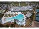 Aerial image of the community pool, cabanas and seating surrounded by meticulously maintained grounds at 754 Blue Iris Way, Summerville, SC 29486