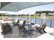 Outdoor lounge area with comfortable seating that overlooks the lake with fountain at 754 Blue Iris Way, Summerville, SC 29486