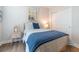 This bedroom features a wooden bed frame, soft blue accents and a sliding door closet at 754 Blue Iris Way, Summerville, SC 29486