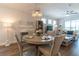 Lovely dining area with pendant lighting open to the living room at 754 Blue Iris Way, Summerville, SC 29486
