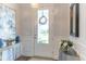 Inviting entryway boasting elegant details and decor, including front door and mirrors at 754 Blue Iris Way, Summerville, SC 29486