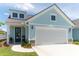 Charming home with a two-car garage, well-manicured lawn, and inviting curb appeal at 754 Blue Iris Way, Summerville, SC 29486