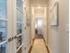 Inviting hallway with wood floors and glass doors leading to a bright, functional space at 754 Blue Iris Way, Summerville, SC 29486