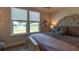 Bedroom view out the windows to neighborhood pond and fountain features white wood trim at 754 Blue Iris Way, Summerville, SC 29486