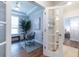 Office with glass desk and french doors, view into a bright ensuite bedroom and bath at 754 Blue Iris Way, Summerville, SC 29486