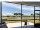 Screened patio offers relaxing outdoor space with views of a pond and surrounding community at 754 Blue Iris Way, Summerville, SC 29486