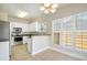 Inviting eat-in kitchen featuring modern stainless steel appliances and plenty of natural light at 7812 Spring Creek Rd, North Charleston, SC 29418