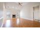 View of the living room featuring fireplace, hardwood floors, ceiling fan and vaulted ceilings at 7812 Spring Creek Rd, North Charleston, SC 29418