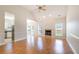 Spacious living room with vaulted ceiling, fireplace, hardwood floors, and lots of natural light at 7812 Spring Creek Rd, North Charleston, SC 29418