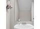 Cozy bathroom featuring white vessel sink, chrome hardware and an unframed mirror at 9009 Cat Tail Pond Rd, Summerville, SC 29485