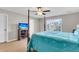 This bedroom features a ceiling fan and a view of the neighborhood at 9009 Cat Tail Pond Rd, Summerville, SC 29485