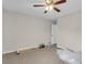 Spacious bedroom with tan carpet and ceiling fan is undergoing renovation at 9009 Cat Tail Pond Rd, Summerville, SC 29485