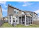 A shot of the back of the home and its screened in back porch at 9009 Cat Tail Pond Rd, Summerville, SC 29485