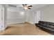This living room has wood-look floors and a futon at 9009 Cat Tail Pond Rd, Summerville, SC 29485