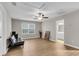 Spacious living room with lots of light, a ceiling fan, and views into the bathroom at 9009 Cat Tail Pond Rd, Summerville, SC 29485