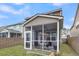 Relaxing screened-in porch with outdoor seating, perfect for enjoying the fresh air and peaceful surroundings at 9009 Cat Tail Pond Rd, Summerville, SC 29485