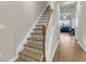 Elegant staircase with decorative tile risers and wood handrail, leading to the living area at 9009 Cat Tail Pond Rd, Summerville, SC 29485