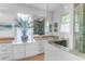 Bright bathroom with white cabinetry, and a tiled walk-in shower with glass enclosure at 932 Middle St, Sullivans Island, SC 29482
