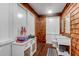 Charming bathroom featuring shiplap walls, white vanity, and American flag decor at 932 Middle St, Sullivans Island, SC 29482