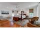 Serene bedroom with a four-poster bed, a seating area, and natural light at 932 Middle St, Sullivans Island, SC 29482