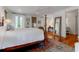 Cozy bedroom featuring a plush bed, beautiful hardwood floors, and elegant decor at 932 Middle St, Sullivans Island, SC 29482