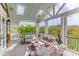 Relaxing covered deck with comfortable seating, offering a perfect space for outdoor enjoyment at 932 Middle St, Sullivans Island, SC 29482