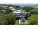 Stunning coastal home with a private pool and lush landscaping, offering an idyllic retreat near the ocean at 932 Middle St, Sullivans Island, SC 29482