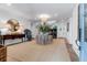 Elegant foyer features a round table centerpiece, beautiful decor, and a glimpse of the staircase to the upper level at 932 Middle St, Sullivans Island, SC 29482