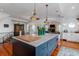Contemporary kitchen with a large island, stylish pendant lights, and open layout to the living areas at 932 Middle St, Sullivans Island, SC 29482