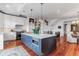 Modern kitchen with a large island, marble countertops, and stainless steel appliances at 932 Middle St, Sullivans Island, SC 29482